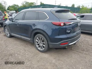 2018 Mazda CX-9 Grand Touring with VIN JM3TCBDY8J0209737, listed as a IAAI auction lot 42374826 with Not provided miles and . Bid and sale history available at DreamBid. Image 3.