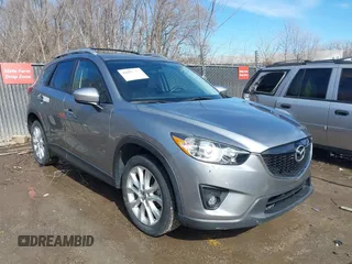 2014 Mazda CX-5 Grand Touring with VIN JM3KE2DY8E0375025, listed as a IAAI auction lot 41657755 with 103,601 mi miles. Bid and sale history available at carsss.com. Image 1.
