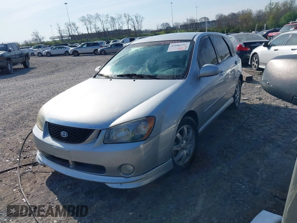 2006 Kia Spectra with VIN KNAFE161365208111, listed as a IAAI auction lot 41886193 with 292,535 mi miles. Bid and sale history available at carsss.com. Image 2.
