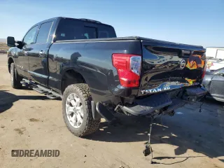 2021 Nissan Titan XD SV with VIN 1N6AA1FB9MN517657, listed as a Copart auction lot 79363644 with 100,628 mi miles and Salvage Title. Bid and sale history available at carsss.com. Image 2.
