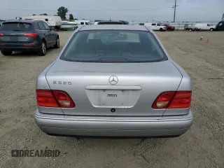 1999 Mercedes-Benz E-Class with VIN WDBJF65H0XA797390, listed as a Copart auction lot 55081405 with 80,950 mi miles and Salvage Title. Bid and sale history available at carsss.com. Image 6.