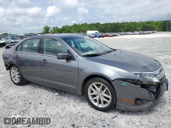 2012 Ford Fusion SEL z VIN 3FAHP0JA4CR371923, wystawiony jako Copart lot #55132125 z przebiegiem 135 390 mil mil oraz Szkody całkowita. Historia ofert i sprzedaży dostępna na DreamBid. Obrazek 4.