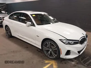 2023 BMW 3 Series 330e xDrive with VIN 3MW39FS05P8D20575, listed as a IAAI auction lot 42076033 with 10,875 mi miles. Bid and sale history available at carsss.com. Image 1.