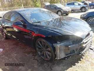 2014 Tesla Model S 60 with VIN 5YJSA1H1XEFP34226, listed as a IAAI auction lot 41806604 with 216,021 mi miles and . Bid and sale history available at DreamBid. Image 1.