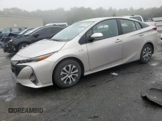 2021 Toyota Prius LE z VIN JTDKAMFP7M3171298, wystawiony jako Copart lot #59473255 z przebiegiem 7 295 mil mil oraz Szkoda całkowita • Salvage title. Historia ofert i sprzedaży dostępna na DreamBid. Obrazek 1.