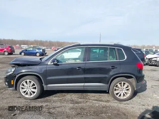 2012 Volkswagen Tiguan SE with VIN WVGAV7AX3CW531264, listed as a IAAI auction lot 41651242 with 190,669 mi miles and . Bid and sale history available at DreamBid. Image 14.