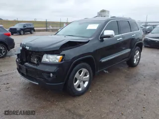 2013 Jeep Grand Cherokee Limited with VIN 1C4RJFBG4DC633137, listed as a IAAI auction lot 41235064 with 163,820 mi miles. Bid and sale history available at carsss.com. Image 2.