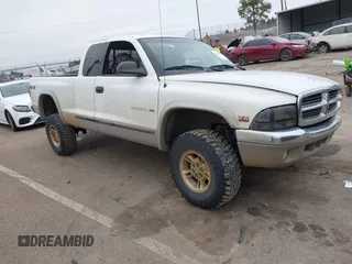 1999 Dodge Dakota SLT with VIN 1B7GG22X3XS223969, listed as a IAAI auction lot 41329085 with 185,859 mi miles and . Bid and sale history available at carsss.com. Image 1.