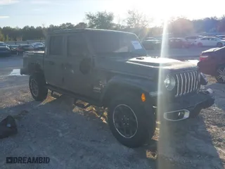 2023 Jeep Gladiator Overland with VIN 1C6HJTFG1PL546604, listed as a IAAI auction lot 41599632 with 23,108 mi miles. Bid and sale history available at carsss.com. Image 1.