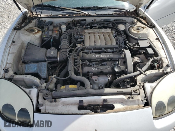 1996 Mitsubishi 3000GT GT z VIN JA3AM84J7TY005775, wystawiony jako Copart lot #70461554 z przebiegiem 102 704 mil mil oraz Tytuł czysty. Historia ofert i sprzedaży dostępna na DreamBid. Obrazek 11.