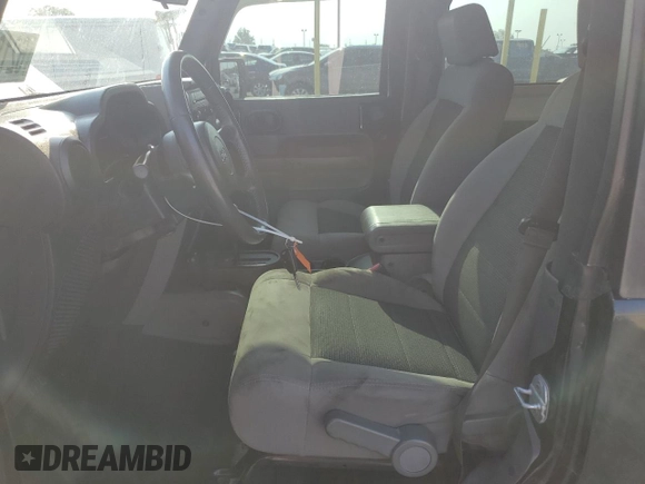 2009 Jeep Wrangler X with VIN 1J4FA24159L772540, listed as a Copart auction lot 62183815 with 179,628 mi miles and Salvage title. Bid and sale history available at DreamBid. Image 7.