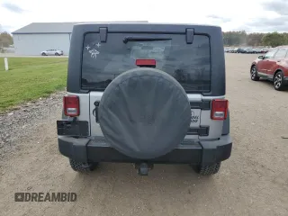 2018 Jeep Wrangler JK Unlimited Sport S with VIN 1C4BJWDG2JL908286, listed as a Copart auction lot 77313844 with 69,497 mi miles and Salvage Title. Bid and sale history available at carsss.com. Image 6.