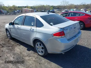 2008 Ford Focus SE with VIN 1FAHP35N48W243314, listed as a IAAI auction lot 42001321 with 210,639 mi miles. Bid and sale history available at carsss.com. Image 3.