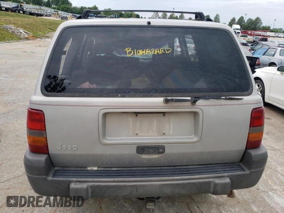 1996 Jeep Grand Cherokee Laredo with VIN 1J4GZ58S2TC401845, listed as a Copart auction lot 61013044 with 0 mi miles and Salvage Title. Bid and sale history available at carsss.com. Image 6.