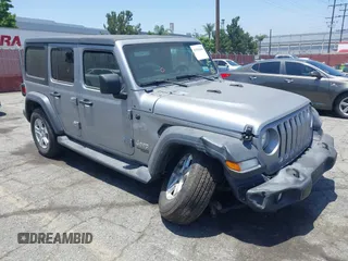 2020 Jeep Wrangler Unlimited Sport S with VIN 1C4HJXDN3LW268895, listed as a IAAI auction lot 42555660 with 60,962 mi miles and . Bid and sale history available at DreamBid. Image 1.