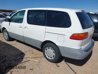 2000 Toyota Sienna CE z VIN 4T3ZF19C7YU203905, wystawiony jako IAAI lot #42256001 z przebiegiem 208 455 mil mil oraz . Historia ofert i sprzedaży dostępna na DreamBid. Obrazek 3.