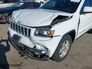 2014 Jeep Grand Cherokee Laredo with VIN 1C4RJEAGXEC130399, listed as a IAAI auction lot 41861664 with 106,925 mi miles. Bid and sale history available at carsss.com. Image 6.