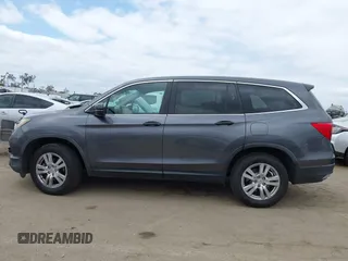 2016 Honda Pilot LX with VIN 5FNYF5H14GB037205, listed as a IAAI auction lot 42034018 with 101,943 mi miles and . Bid and sale history available at DreamBid. Image 14.