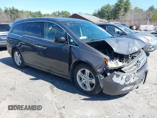 2012 Honda Odyssey Touring with VIN 5FNRL5H90CB048070, listed as a IAAI auction lot 41835799 with 162,288 mi miles. Bid and sale history available at carsss.com. Image 1.