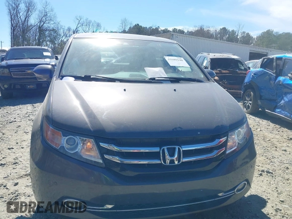 2014 Honda Odyssey Touring with VIN 5FNRL5H92EB016546, listed as a IAAI auction lot 41689148 with 143,601 mi miles and . Bid and sale history available at DreamBid. Image 12.