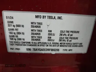 2024 Tesla Model Y Long Range with VIN 7SAYGAEE2RF986206, listed as a IAAI auction lot 42177852 with 14,399 mi miles and . Bid and sale history available at carsss.com. Image 9.