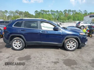 2015 Jeep Cherokee Latitude with VIN 1C4PJLCB5FW694359, listed as a IAAI auction lot 41934213 with 117,723 mi miles and . Bid and sale history available at DreamBid. Image 13.