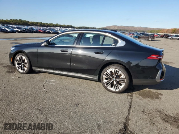 2024 BMW 5 Series 530i xDrive with VIN WBA53FJ00RCS00741, listed as a Copart auction lot 84899434 with 7,103 mi miles and Salvage Title. Bid and sale history available at carsss.com. Image 2.