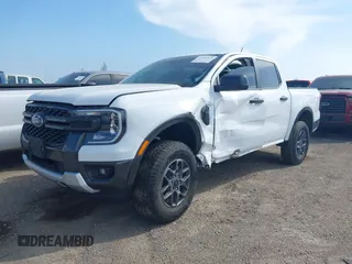2024 Ford Ranger XLT with VIN 1FTER4GH1RLE26029, listed as a IAAI auction lot 41958379 with 9,716 mi miles and . Bid and sale history available at DreamBid. Image 2.