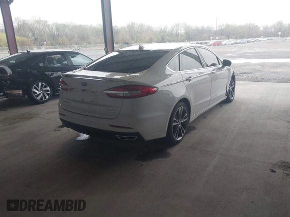 2019 Ford Fusion Titanium with VIN 3FA6P0K95KR271291, listed as a IAAI auction lot 41983320 with 71,962 mi miles and . Bid and sale history available at DreamBid. Image 4.