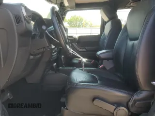 2013 Jeep Wrangler Sahara with VIN 1C4AJWBG8DL602065, listed as a Copart auction lot 52082535 with 110,727 mi miles and Salvage title. Bid and sale history available at DreamBid. Image 7.