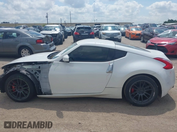 2012 Nissan 370Z z VIN JN1AZ4EH5CM564517, wystawiony jako IAAI lot #42385869 z przebiegiem 55 359 mil mil oraz . Historia ofert i sprzedaży dostępna na DreamBid. Obrazek 15.