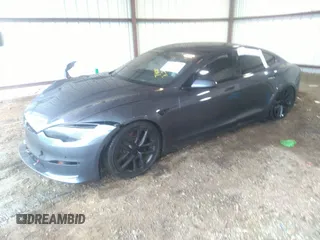 2022 Tesla Model S with VIN 5YJSA1E57NF484158, listed as a IAAI auction lot 41531574 with 16,079 mi miles and . Bid and sale history available at DreamBid. Image 2.