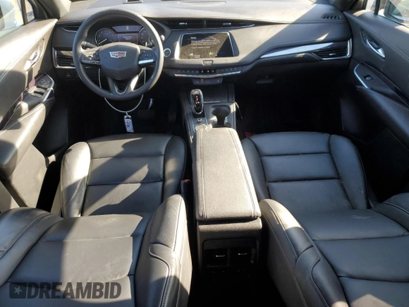 2021 Cadillac XT4 FWD Luxury z VIN 1GYAZAR49MF081955, wystawiony jako Copart lot #76611074 z przebiegiem 34 635 mil mil oraz Szkoda całkowita • Salvage title. Historia ofert i sprzedaży dostępna na DreamBid. Obrazek 8.