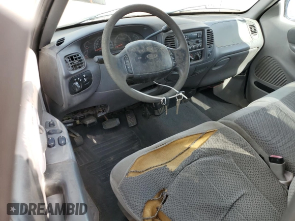 1999 Ford F-150 with VIN 2FTRX17L0XCA37979, listed as a Copart auction lot 58216695 with 256,055 mi miles and Clean title. Bid and sale history available at DreamBid. Image 8.