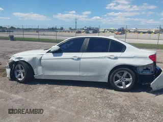 2014 BMW 3 Series 320i with VIN WBA3B1C51EK131063, listed as a IAAI auction lot 42043086 with 92,306 mi miles. Bid and sale history available at carsss.com. Image 14.