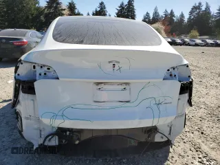2023 Tesla Model Y Long Range z VIN 7SAYGDEE7PF788932, wystawiony jako Copart lot #52822515 z przebiegiem 33 007 mil mil oraz Szkoda całkowita • Salvage title. Historia ofert i sprzedaży dostępna na DreamBid. Obrazek 6.