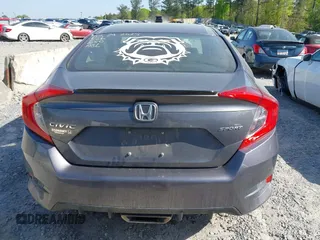 2019 Honda Civic Sport with VIN 2HGFC2F8XKH598141, listed as a IAAI auction lot 42013724 with 98,401 mi miles and . Bid and sale history available at DreamBid. Image 16.