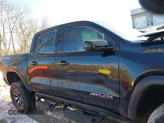 2024 GMC Canyon 4WD AT4X with VIN 1GTP6EEK7R1222174, listed as a IAAI auction lot 41377759 with 2,642 mi miles. Bid and sale history available at carsss.com. Image 13.