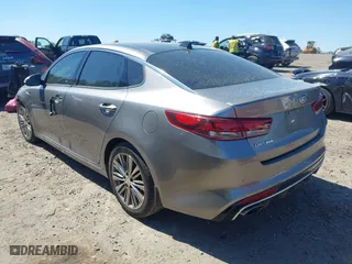 2018 Kia Optima SX with VIN 5XXGV4L26JG187281, listed as a IAAI auction lot 41887939 with 124,782 mi miles. Bid and sale history available at carsss.com. Image 3.