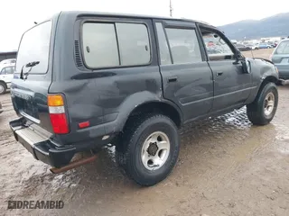 1996 Toyota Land Cruiser with VIN JT3HJ85J4T0115628, listed as a IAAI auction lot 41191476 with 210,005 mi miles. Bid and sale history available at carsss.com. Image 4.