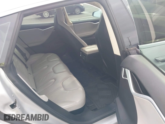 2013 Tesla Model S with VIN 5YJSA1AC3DFP10537, listed as a IAAI auction lot 40707549 with 103,111 mi miles and . Bid and sale history available at DreamBid. Image 8.