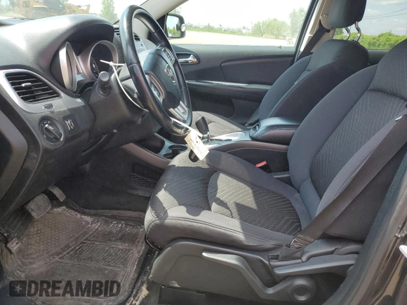 2013 Dodge Journey SE with VIN 3C4PDCAB0DT500365, listed as a Copart auction lot 61033665 with 193,231 mi miles and Salvage title. Bid and sale history available at DreamBid. Image 7.