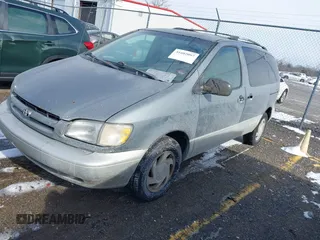 1999 Toyota Sienna LE with VIN 4T3ZF13C2XU118641, listed as a IAAI auction lot 41602097 with 261,792 mi miles. Bid and sale history available at carsss.com. Image 2.