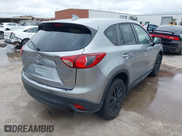 2014 Mazda CX-5 Touring z VIN JM3KE2CY8E0369145, wystawiony jako IAAI lot #42462985 z przebiegiem 155 480 mil mil oraz . Historia ofert i sprzedaży dostępna na DreamBid. Obrazek 4.