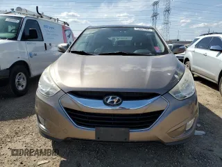 2010 Hyundai Tucson GLS with VIN KM8JU3AC8AU056499, listed as a Copart auction lot 53057365 with 119,906 mi miles and Salvage Title. Bid and sale history available at DreamBid. Image 5.