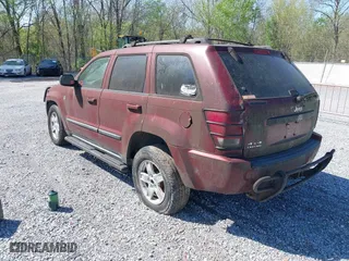 2007 Jeep Grand Cherokee Laredo with VIN 1J8HR48P07C694448, listed as a IAAI auction lot 41956077 with 232,366 mi miles. Bid and sale history available at carsss.com. Image 3.