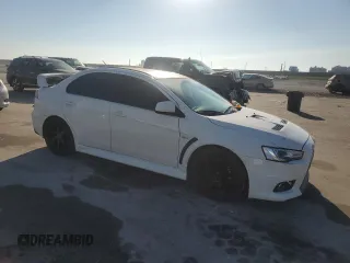 2014 Mitsubishi Lancer Evolution GSR z VIN JA32W8FV5EU023703, wystawiony jako Copart lot #72744504 z przebiegiem Nie podano mil oraz Szkody całkowita. Historia ofert i sprzedaży dostępna na DreamBid. Obrazek 4.
