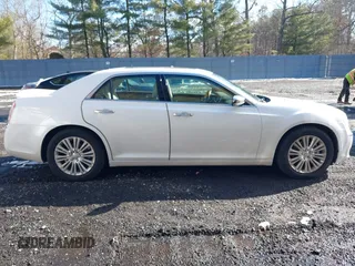 2013 Chrysler 300 with VIN 2C3CCAKGXDH733148, listed as a IAAI auction lot 41541442 with 216,074 mi miles. Bid and sale history available at carsss.com. Image 13.