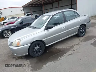 2005 Kia Rio with VIN KNADC125556380753, listed as a IAAI auction lot 41794121 with 139,759 mi miles. Bid and sale history available at carsss.com. Image 2.