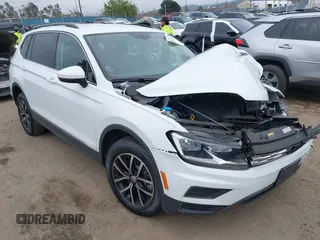 2021 Volkswagen Tiguan SE z VIN 3VV3B7AX9MM091043, wystawiony jako IAAI lot #42072951 z przebiegiem 47 433 mil mil oraz . Historia ofert i sprzedaży dostępna na DreamBid. Obrazek 1.